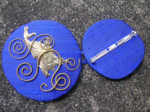 Blue spirals brooch with back